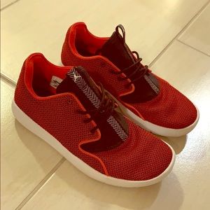 Women’s red Jordan eclipse sneakers
